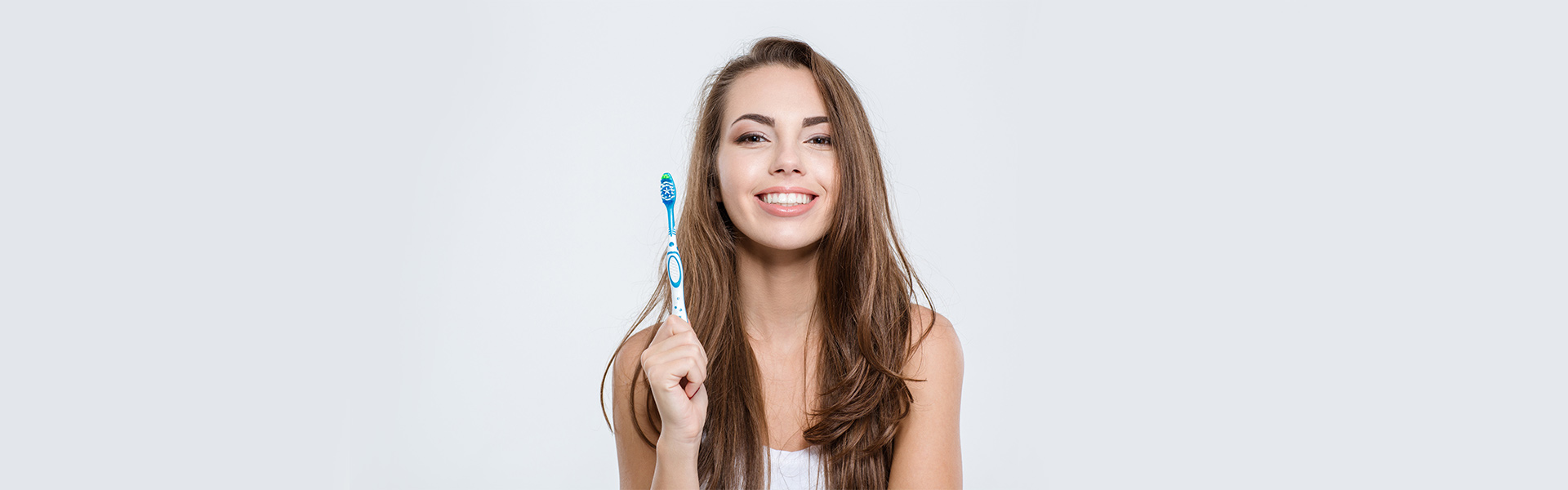 Lady Holding Toothbrush in Hand